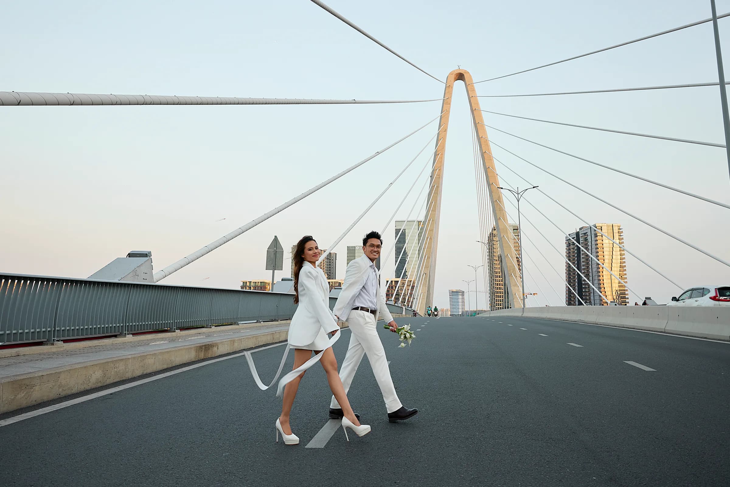 Josh and Analie walking on the bridge